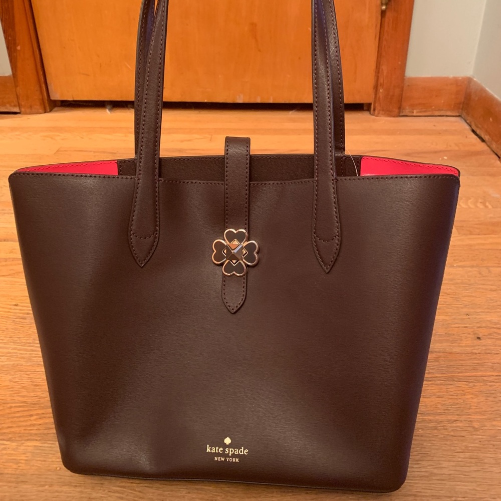 Maroon leather KATE SPADE purse. Hot pink lining.